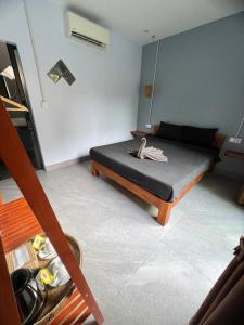 a bedroom with a bed in a room at Monkey Republic Kampot in Kampot