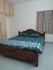 a bed with two pillows on it in a room at RKGroupStays in Tirupati