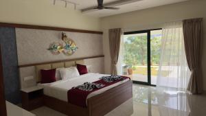 Postel nebo postele na pokoji v ubytování Southern Panorama Campnoel Munnar + 117 fotografií