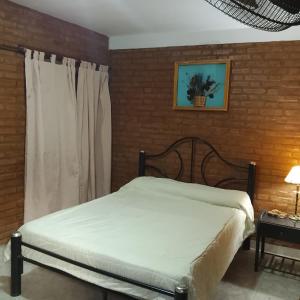 Ένα ή περισσότερα κρεβάτια σε δωμάτιο στο Hostería huanel