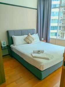 Ένα ή περισσότερα κρεβάτια σε δωμάτιο στο vortex Suites KLCC