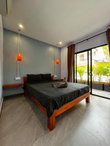 Postel nebo postele na pokoji v ubytování Monkey Republic Kampot