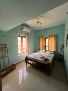 Ένα ή περισσότερα κρεβάτια σε δωμάτιο στο GingerLime Surf and Bakery House