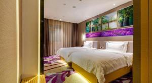 Ένα ή περισσότερα κρεβάτια σε δωμάτιο στο Lavande Hotel Wuhan Jianghan Road Subway Station +208 φωτογραφίες
