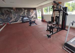 a gym with two tread machines in a room at Ponta Negra Apartment in Manaus