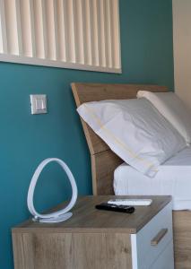 En eller flere senge i et værelse på Lambrusco Apartment Monolocale vicino al Centro di Modena Università e Policlinico