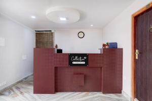 a lobby with a counter with a sign on it at Super Collection O Police Bazar Shillong Formerly Pillars House in Shillong