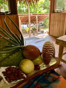 a tray of fruits and nuts on a table at Beachfront on Aore Island Private Island Stay in Aimbuei Bay