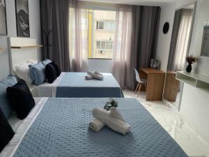 Postel nebo postele na pokoji v ubytování Copacabana Beach House III, 50 Metros da Praia,Moderno e Aconchegante