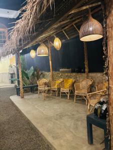 a group of chairs and lights in a room at Pranaya Hiriketiya in Hiriketiya +15 photos