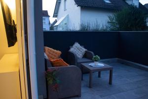 Posezení v ubytování Joli appartement en RDC dans une maison neuve