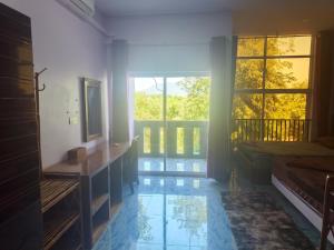 a bedroom with a view of a pool at VibeHostel in Kampot