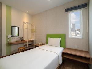 Ένα ή περισσότερα κρεβάτια σε δωμάτιο στο Kama Hotel +53 φωτογραφίες