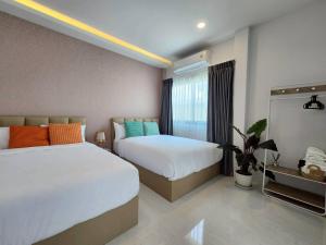 Postel nebo postele na pokoji v ubytování Beloved Bliss Pool Villa Bangsaen