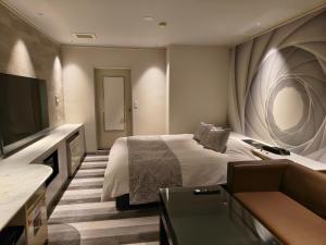 Et tv og/eller underholdning på Hotel The Moon -Adult Only-