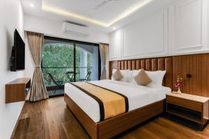 Postel nebo postele na pokoji v ubytování SinQ Symbol