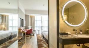 Ένα ή περισσότερα κρεβάτια σε δωμάτιο στο Echeng Hotel Nanning the Mixc Convention +41 φωτογραφίες