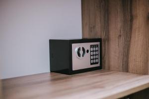 a black and white clock sitting on top of a counter at Hypogeon Residence in Bitola