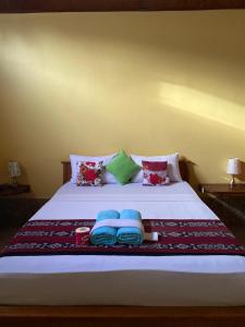 Кровать или кровати в номере MAHADING cottages