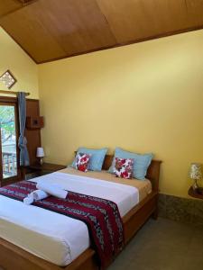 Кровать или кровати в номере MAHADING cottages