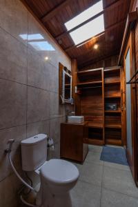 a bathroom with a toilet and a sink at Arta Bali Glamping in Tianyar +19 photos