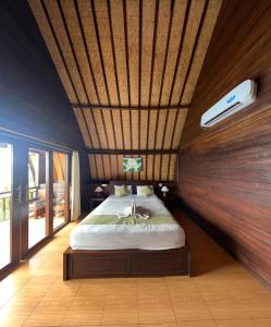 Ένα ή περισσότερα κρεβάτια σε δωμάτιο στο Bataran Garden Cottage