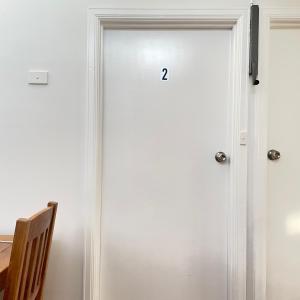 a door with the number on it at Budget-friendly room near Sunshine Station to CBD in Sunshine