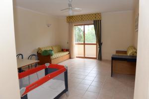 a living room with a couch and a table at Casa Vacanze Oasi Felicita in Nova Siri Marina