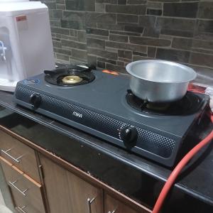 a pot on top of a stove in a kitchen at Mikes apartment in Mombasa