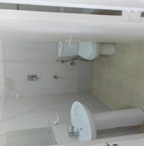 a bathroom with a toilet and a sink at Mount Villa in Dehiwala