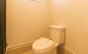 a bathroom with a toilet and a bath tub at RedDoorz at Casa Marabella Villamonte Bacolod City in Bacolod +15 photos