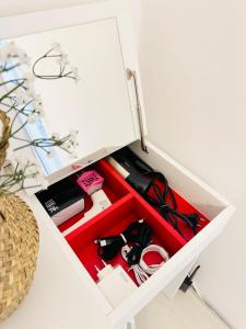 a white cabinet with a drawer filled with tools at Won-Stay in Samgong