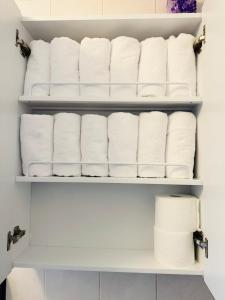 a closet filled with rolls of toilet paper at Won-Stay in Samgong