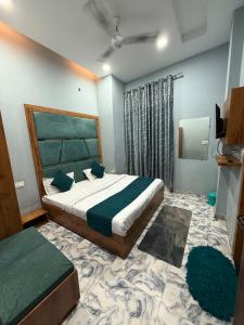 a bedroom with a king sized bed in a room at Sodhi Residency in Amritsar