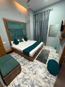 a bedroom with a large bed and a large rug at Sodhi Residency in Amritsar