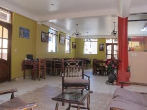a living room with a chair and a dining room at Tumy house B&B in Ollantaytambo +32 photos