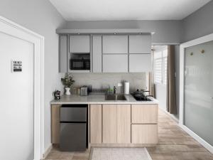 a kitchen with a sink and a counter top at Casa Cueva Beach House for 14 PPL in Arecibo in Arecibo