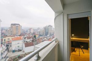 a balcony with a view of a city at NAR Royalton Apartment #60 in Niš