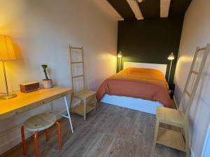 Postel nebo postele na pokoji v ubytování L'Ecrin de la Petite France