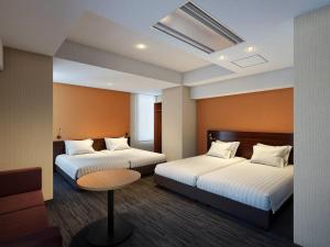 Ένα ή περισσότερα κρεβάτια σε δωμάτιο στο Comfort Inn Tokyo Roppongi