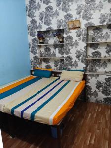a bedroom with two beds in a room at Shri Krishna Residency in Sawāi Mādhopur +5 photos