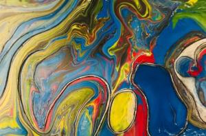 a painting of multicolored paint on a table at Plaza Mayor de Leon in León +1 photo