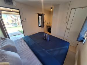 a room with a blue table with two shoes on it at So Good in Pai +50 photos