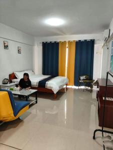 Postel nebo postele na pokoji v ubytování 海鑫宾馆