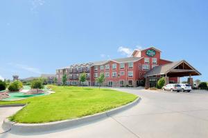 a large red building with a clock on it at Norfolk Lodge & Suites, an Ascend Collection Hotel in Norfolk