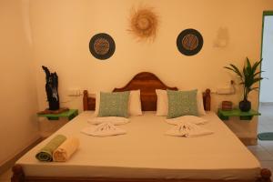 Giường trong phòng chung tại Nirvana Hiri