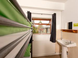 a bathroom with a sink and a window at YHA Hathersage - Partner in Hathersage +23 photos