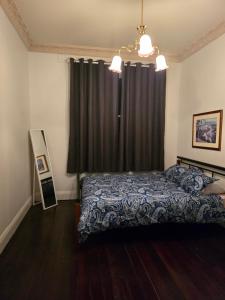 Ένα ή περισσότερα κρεβάτια σε δωμάτιο στο Nottingham way Homestay