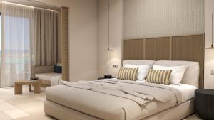 Ένα ή περισσότερα κρεβάτια σε δωμάτιο στο Atlantica Callisto +52 φωτογραφίες