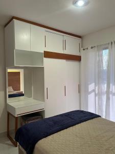 a bedroom with a bed and white cabinets and a desk at New ground floor apartment, very comfortable and excellent location in Mazatlán +73 photos